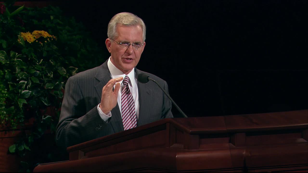 A photo of Elder D. Todd Christofferson standing at the pulpit in the General Conference Center.