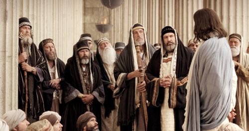 Jesus talking to Pharisees in Jerusalem. Movie still from The Life of Jesus Christ Bible Videos.
