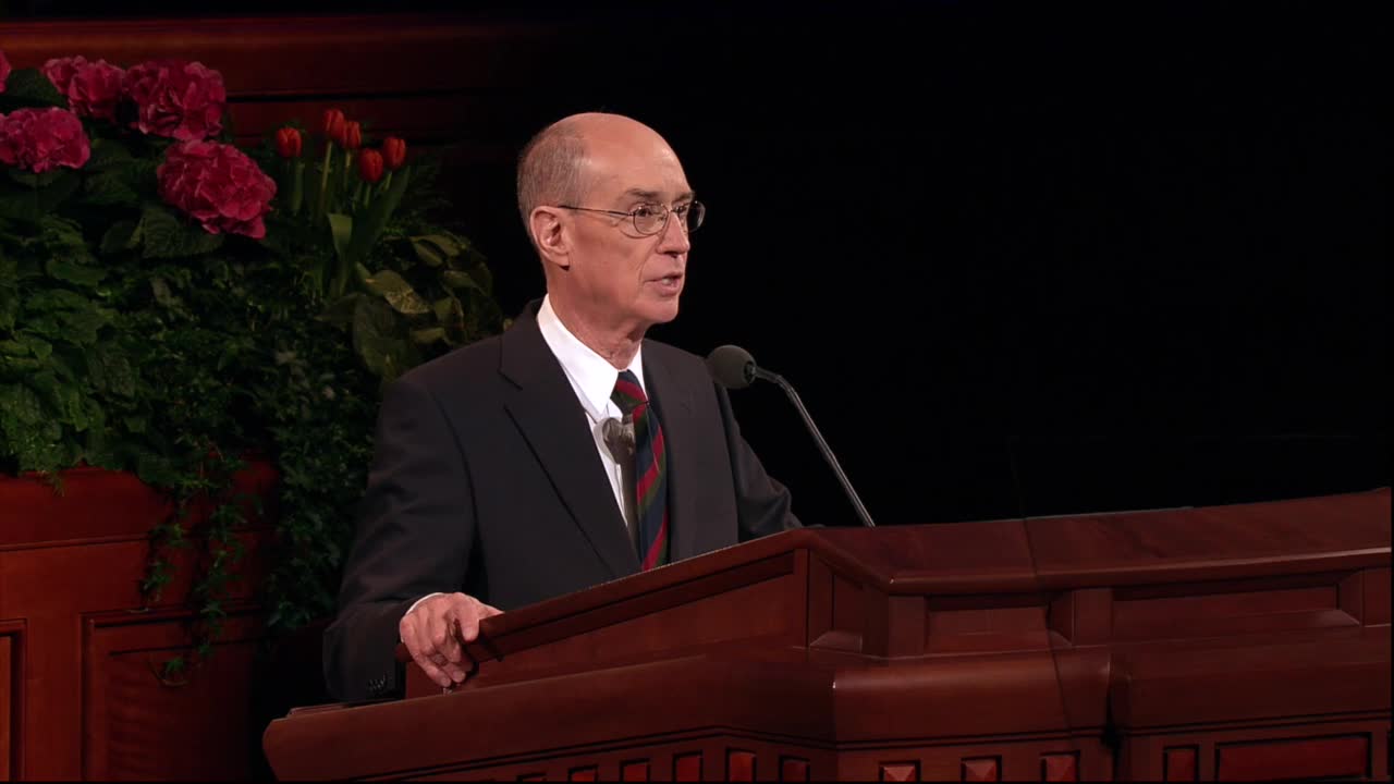 A photo of President Henry B. Eyring standing at the pulpit in the General Conference Center.