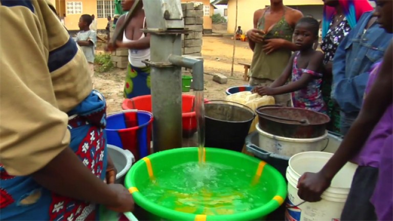 Clean water pouring into bucket