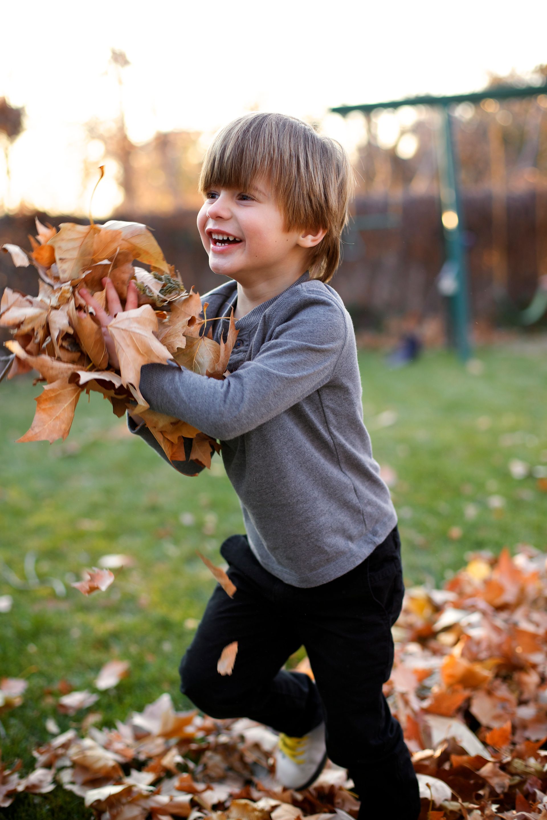 Child Running with Leaves