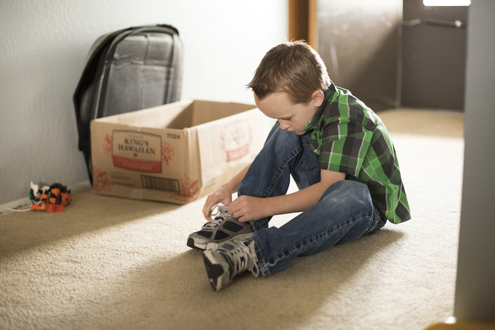 Boy Tying His Shoes