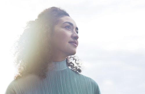 United Kingdom: Young woman looking into distance