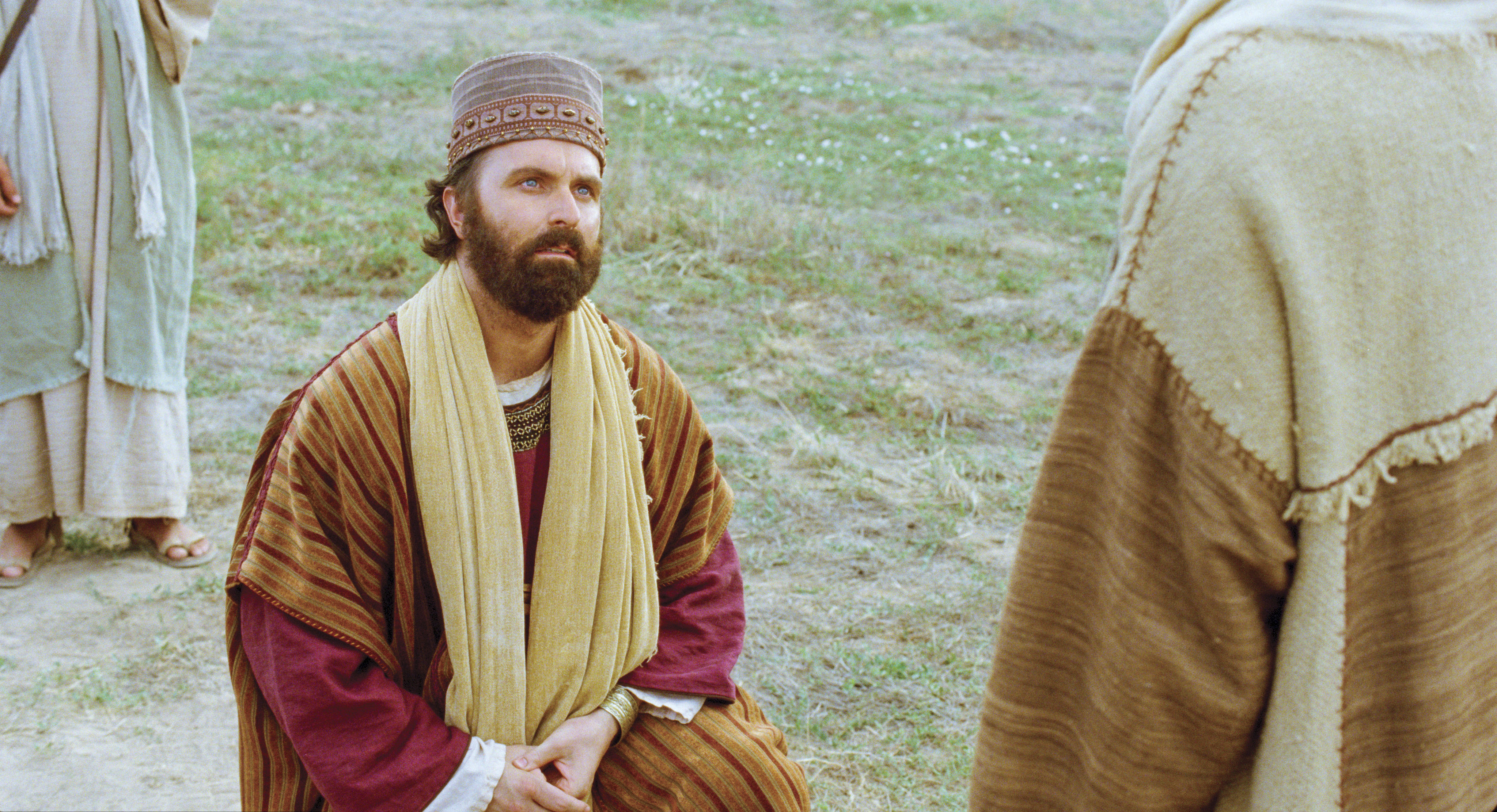 The rich young ruler kneels before Christ and asks Him what he should do to have eternal life.