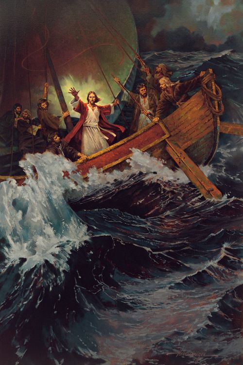 Jesus wearing white and red robes, with arms outstretched, standing near His Apostles on a ship that is being tossed on large waves.