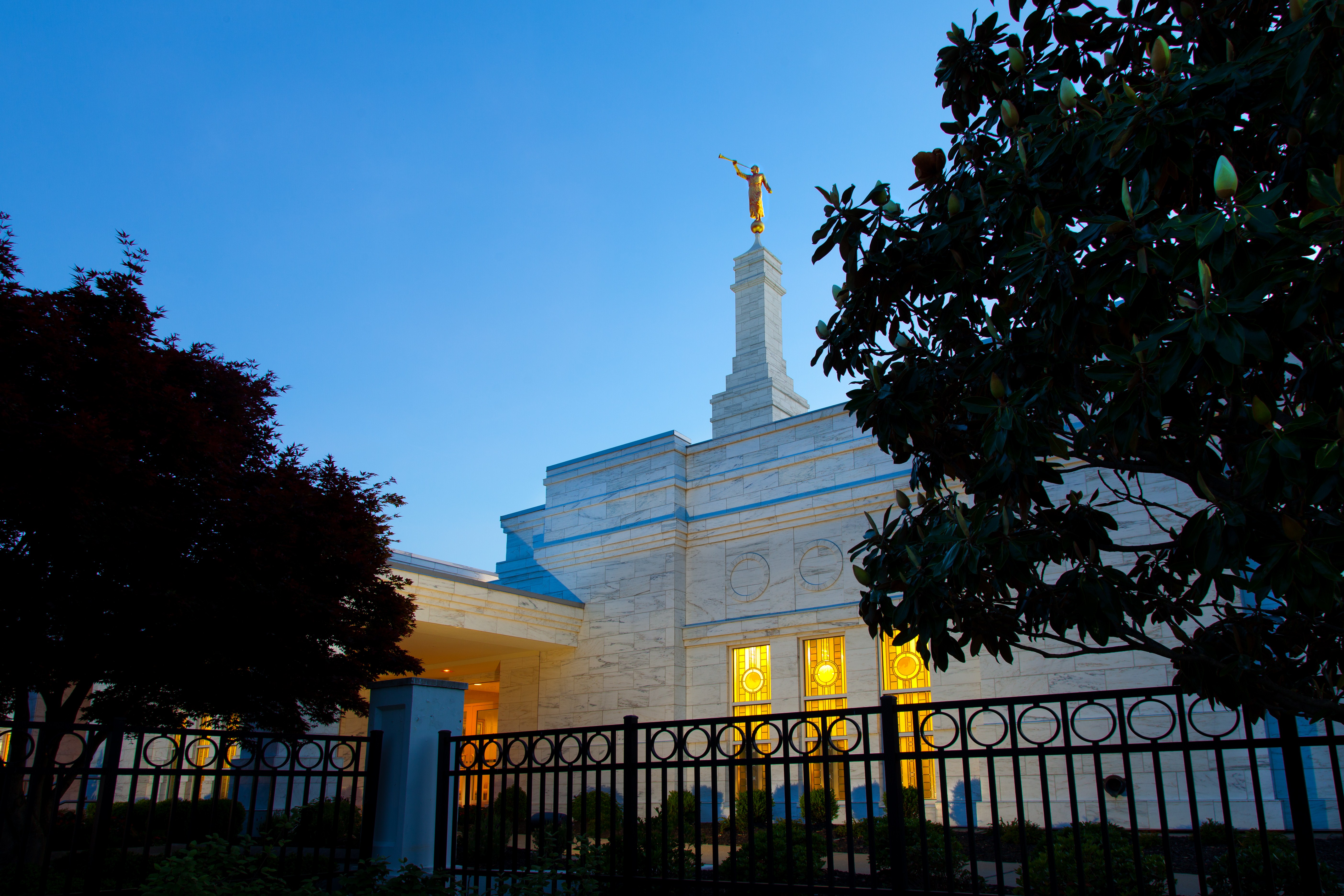 Light shining through the windows of the Memphis Tennessee Temple in the evening.