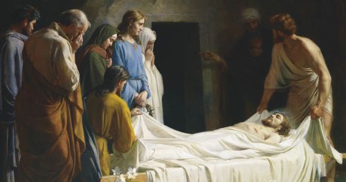 白い埋葬布に包まれた十字架上で亡くなられたキリストの体