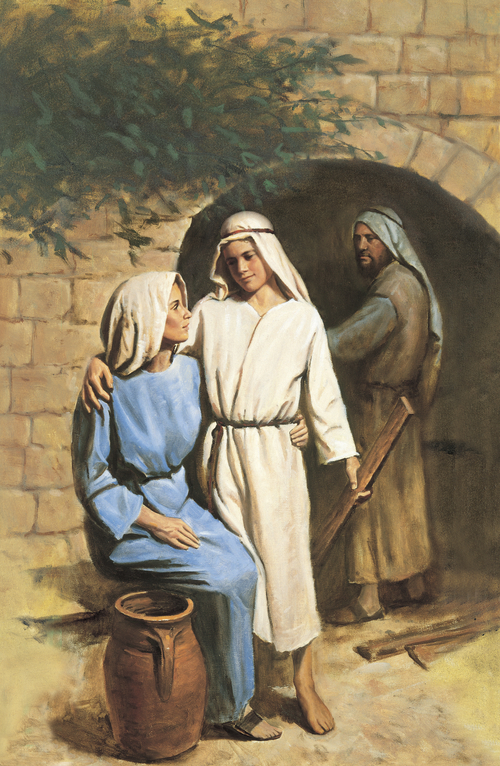 Young Jesus in white robes, standing next to His mother, Mary, and putting His arm around her while Joseph looks on in the background.