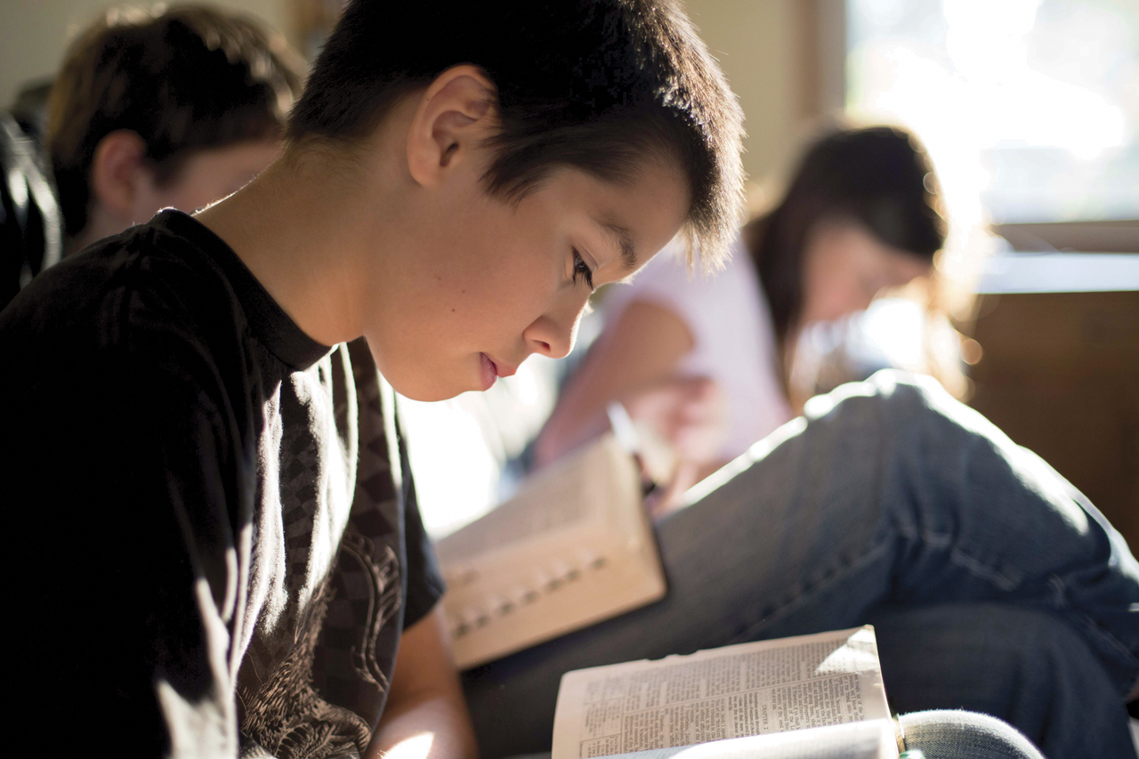 Young Boy Reading the Scriptures