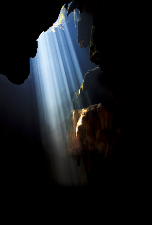 a cave with light showing through