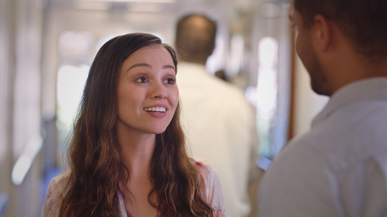 A young woman talking to someone else