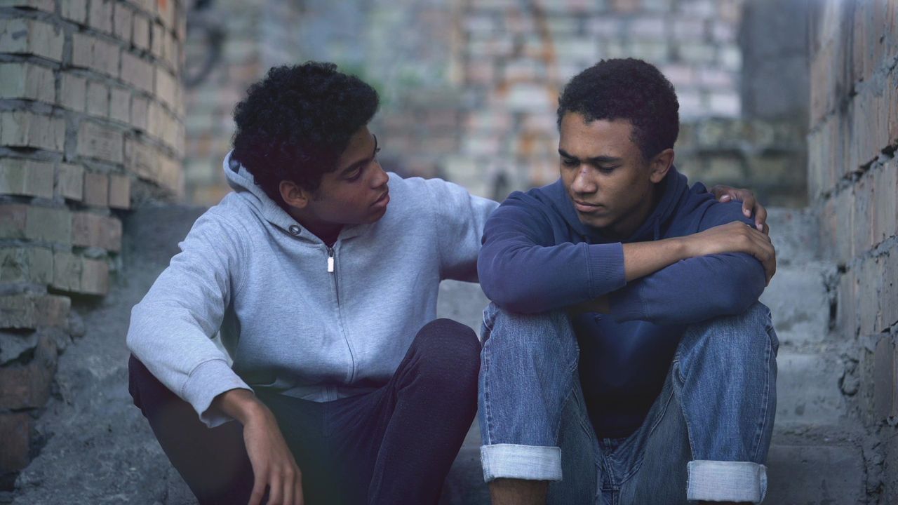 A man grieves over the death of a loved one