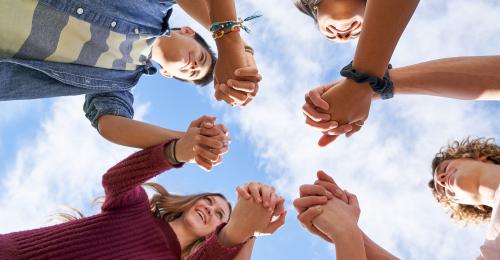 youth holding hands in a circle