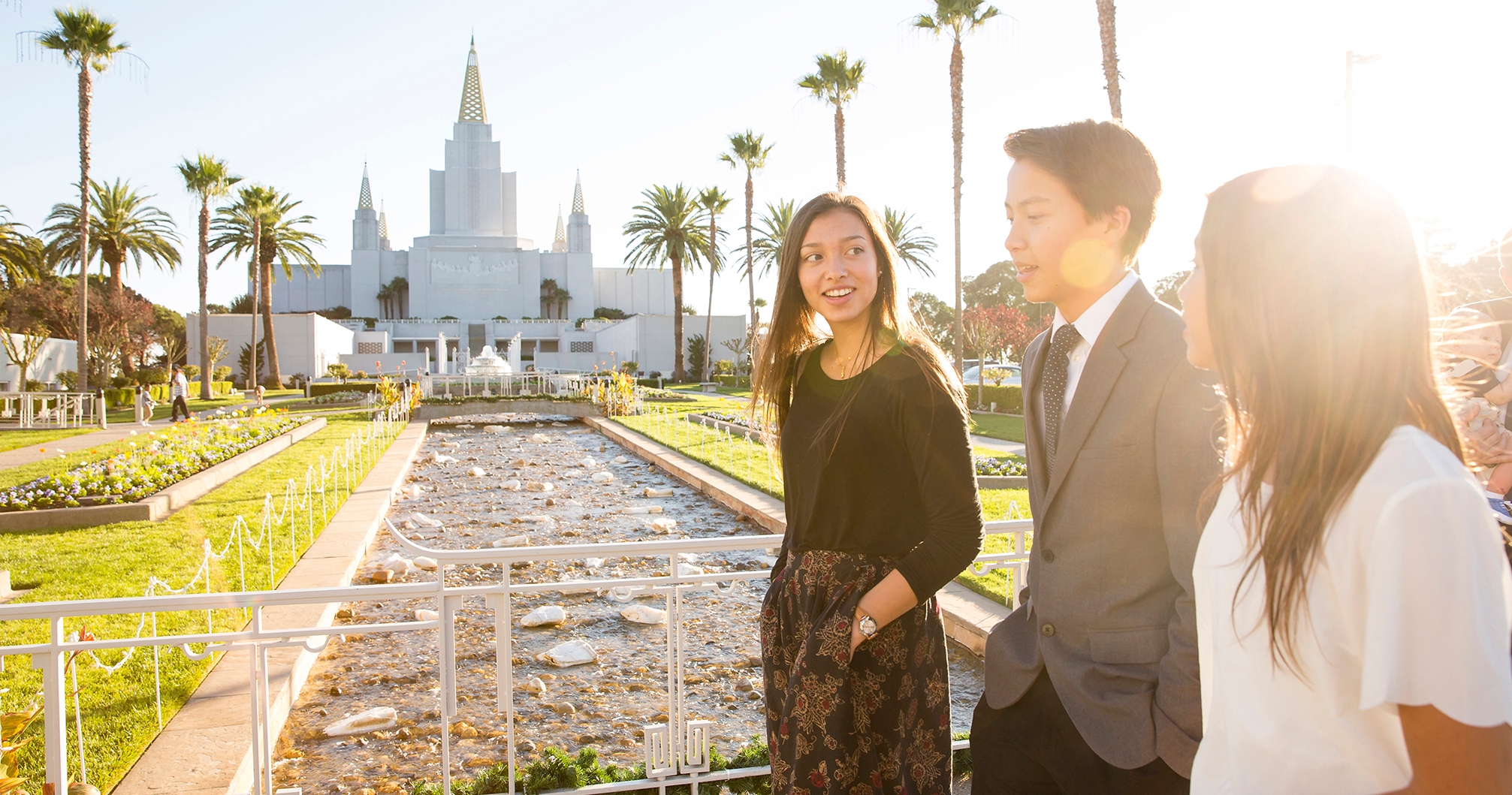 Siblings stroll grounds of Oakland temple.