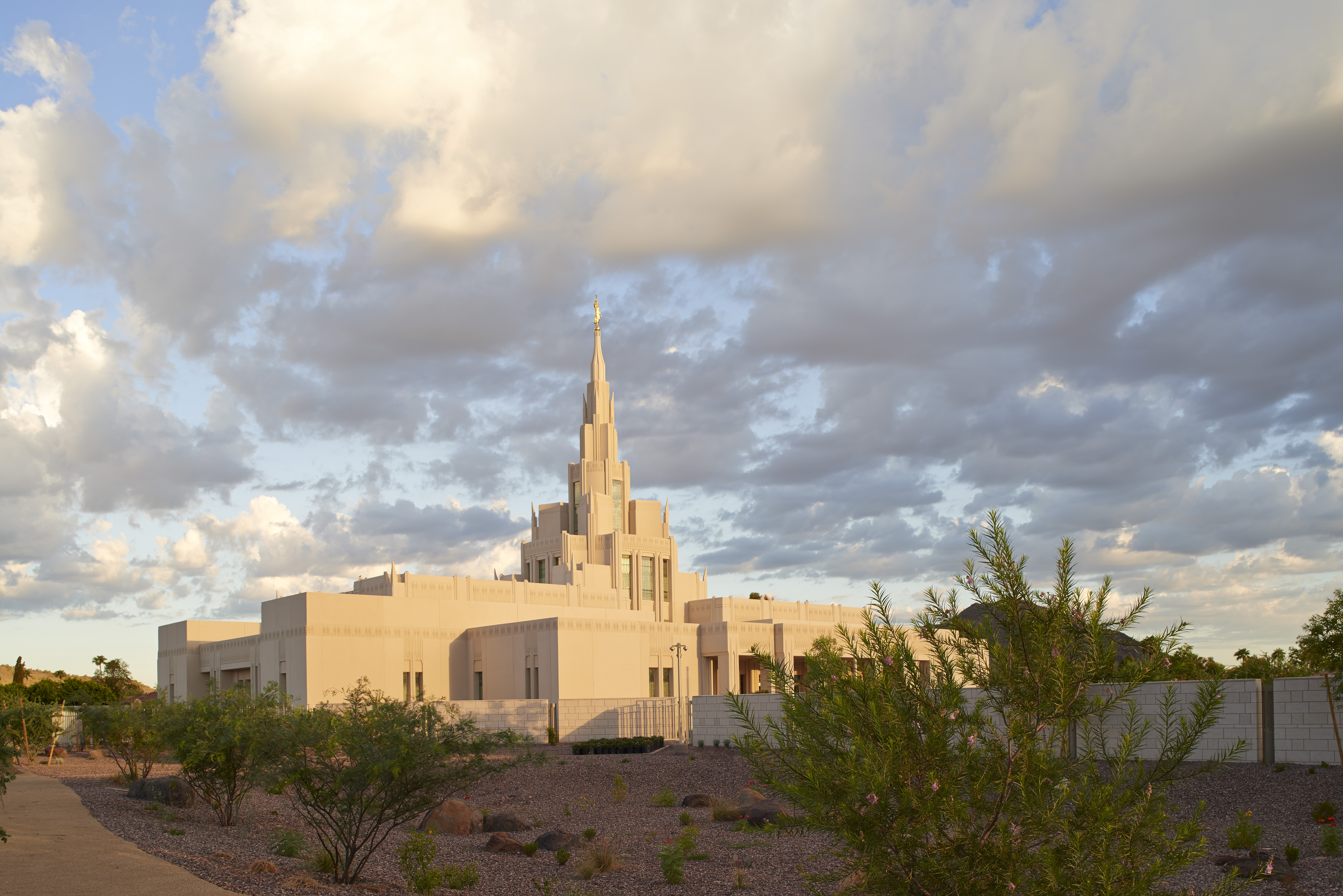 The Phoenix Arizona Temple during sunset, including scenery and a cloudy sky.