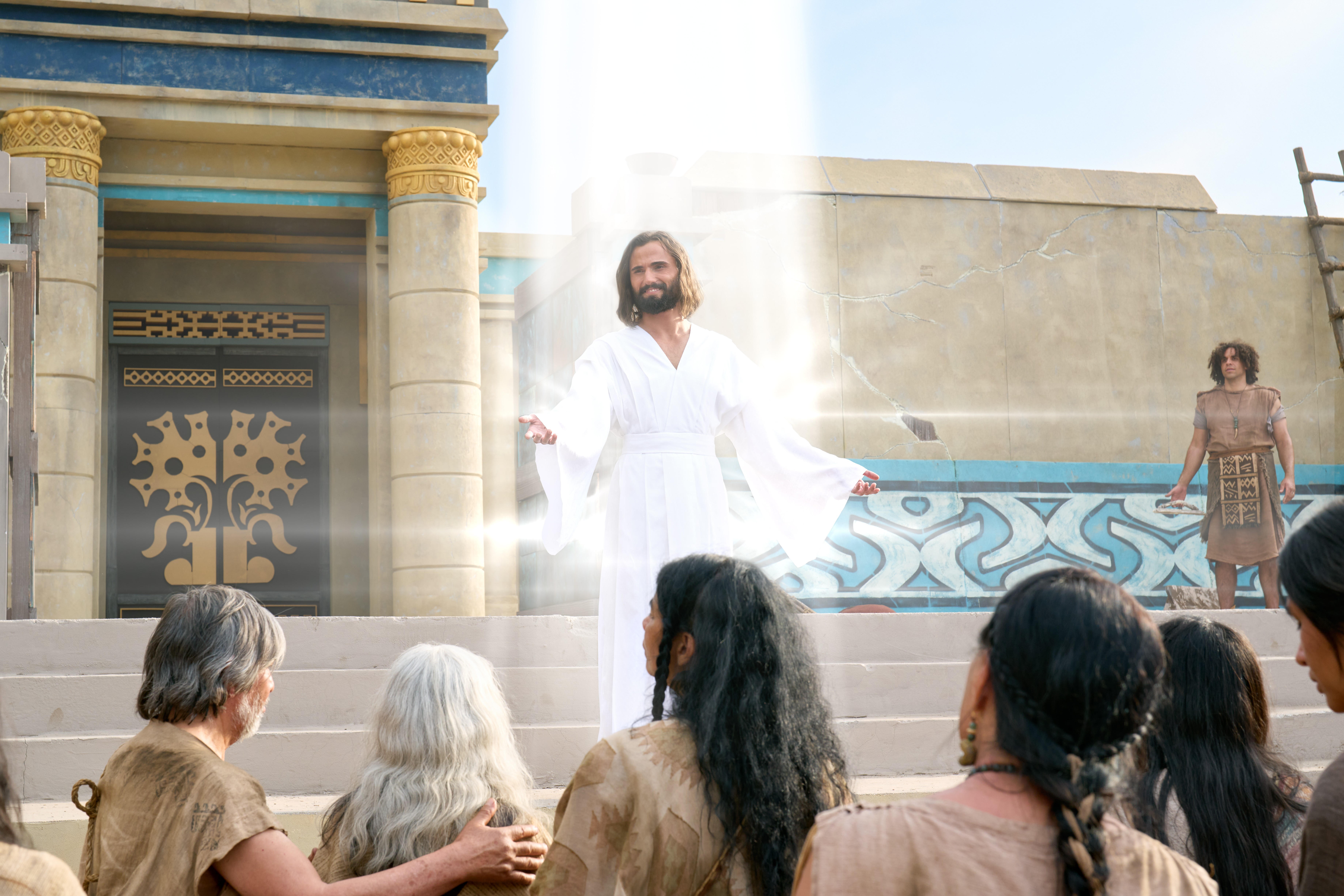 Jesus Christ descends from Heaven in a beam of light in front of a temple in Land Bountiful.
