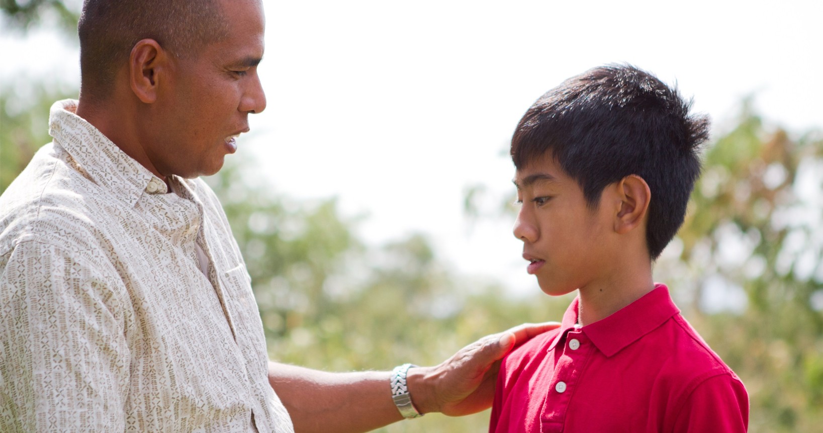 Father talking to his son.