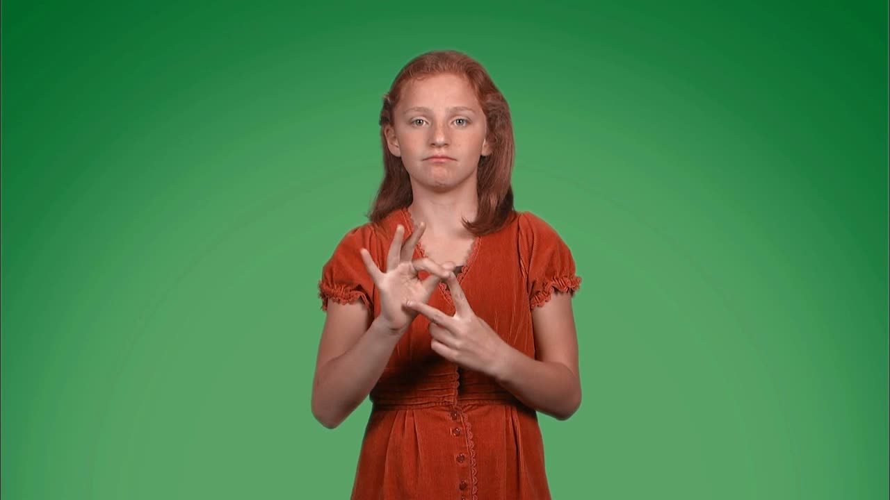 A girl uses sign language