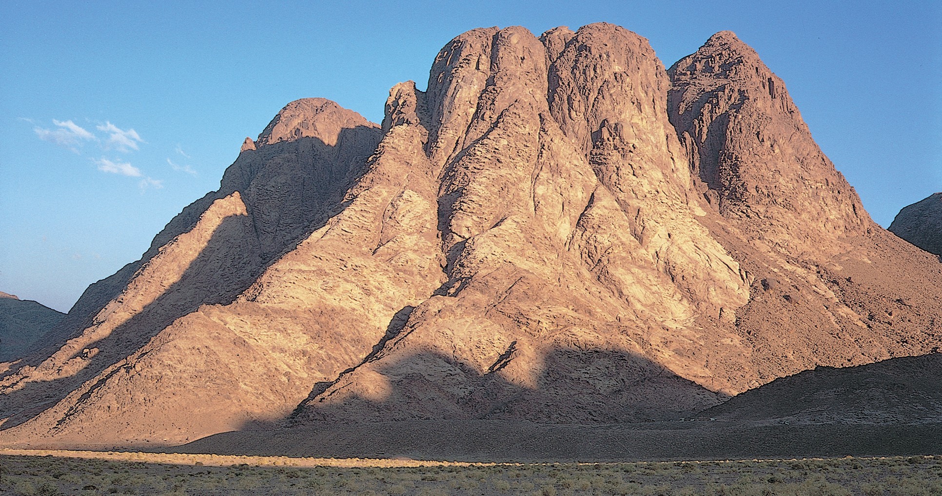 Morning light on a traditional site of Mount Sinai in Egypt.Biblical/Historical info: Near Mount Sinai, Moses watched the flocks of his father-in-law Jethro and saw the burning bush.(See Exodus 3:1 ; 4-17)