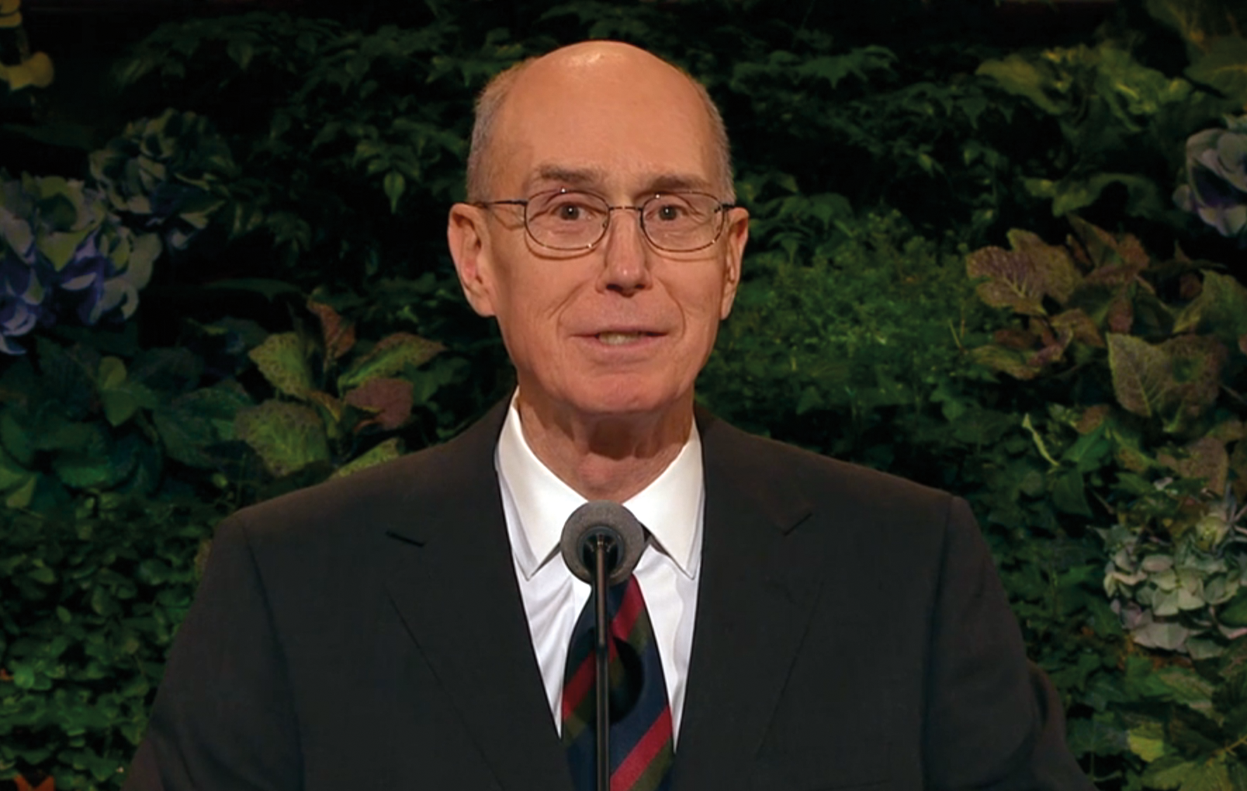 President Henry B. Eyring speaking from a pulpit.