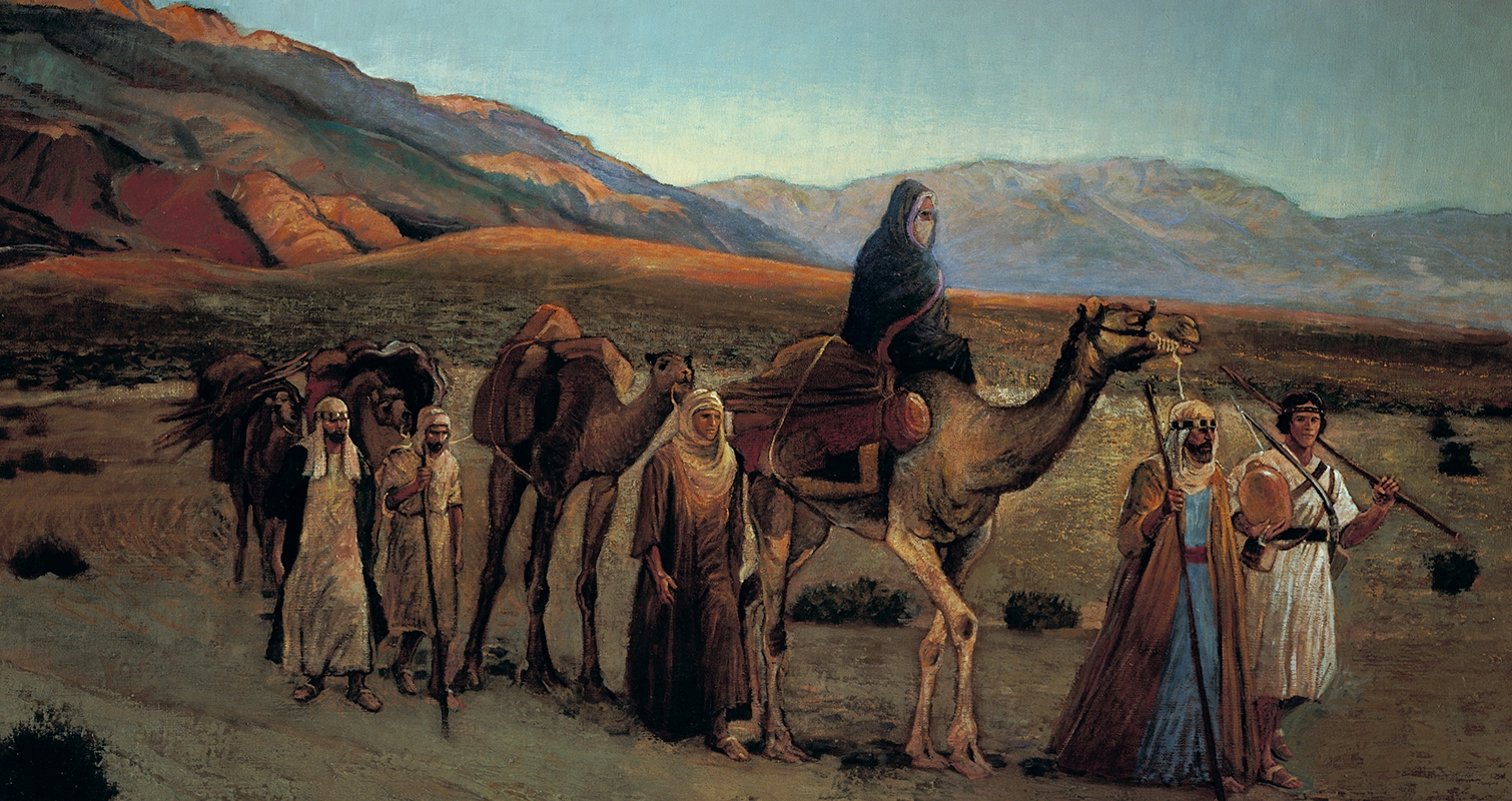 Lehi and his family walking and riding camels near the Red Sea. There are rolling hills in the background.