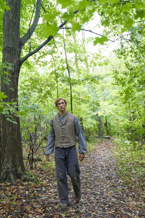 Joseph Smith Jr. walks through the woods on the Hill Cumorah.