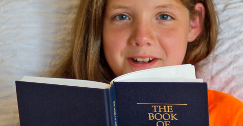 Girl with Book of Mormon