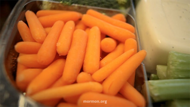 A tray of carrots, celery, and ranch dip