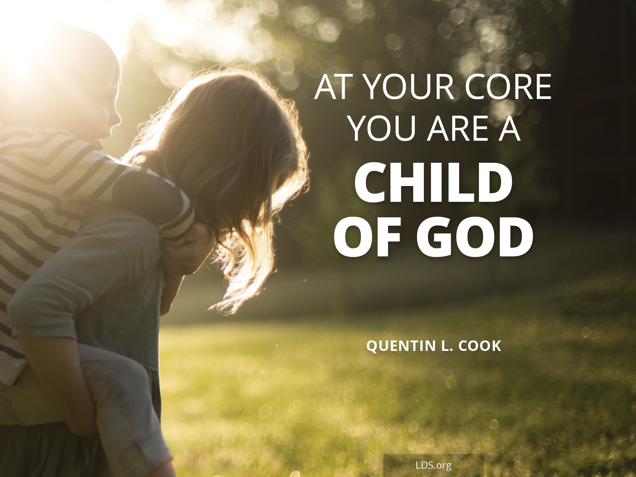 An image of a young child giving a toddler a piggyback ride with the words “At your core you are a child of God.”