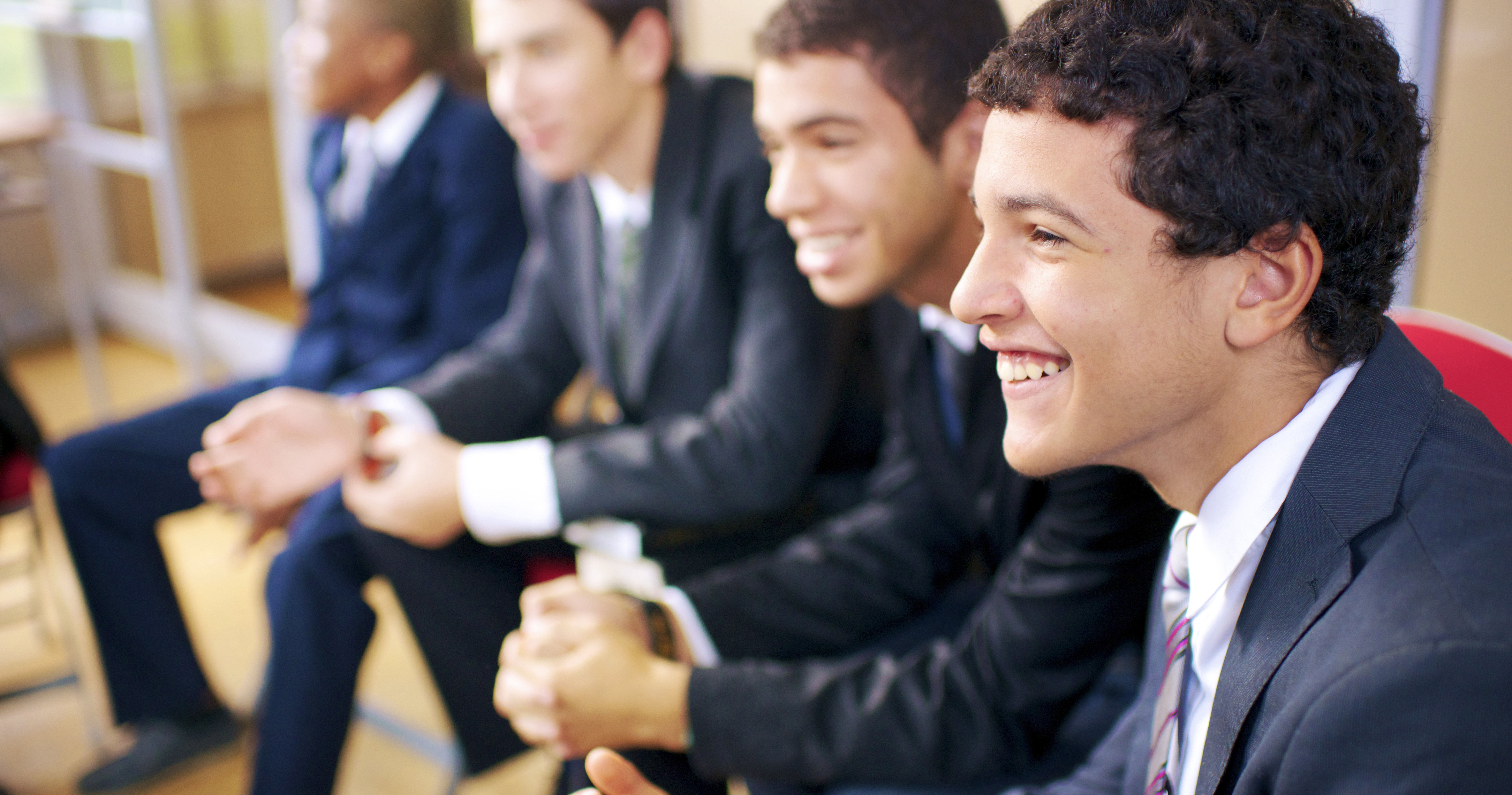 Young men attending priesthood quorum meetings.