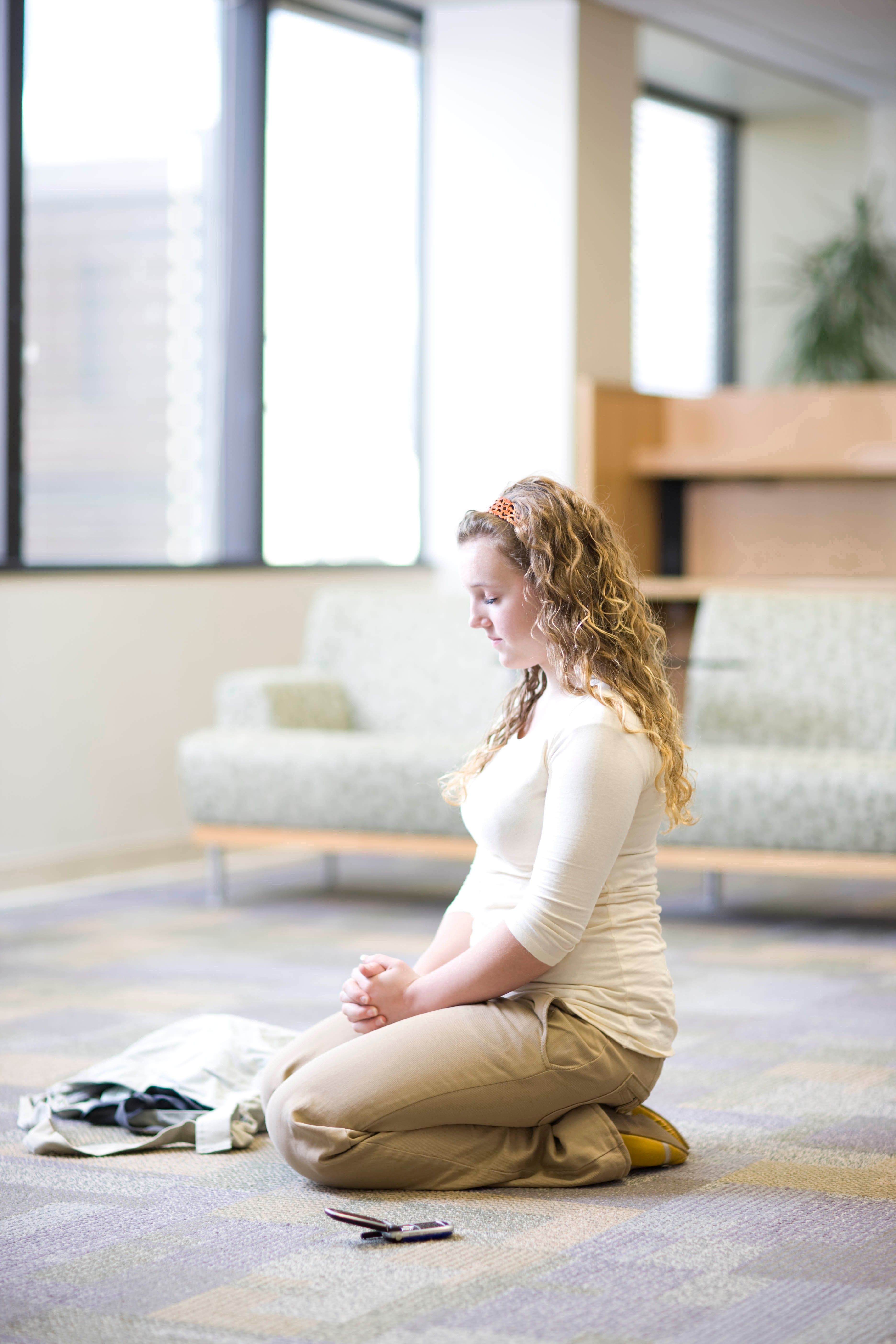 Woman Kneeling In Prayer